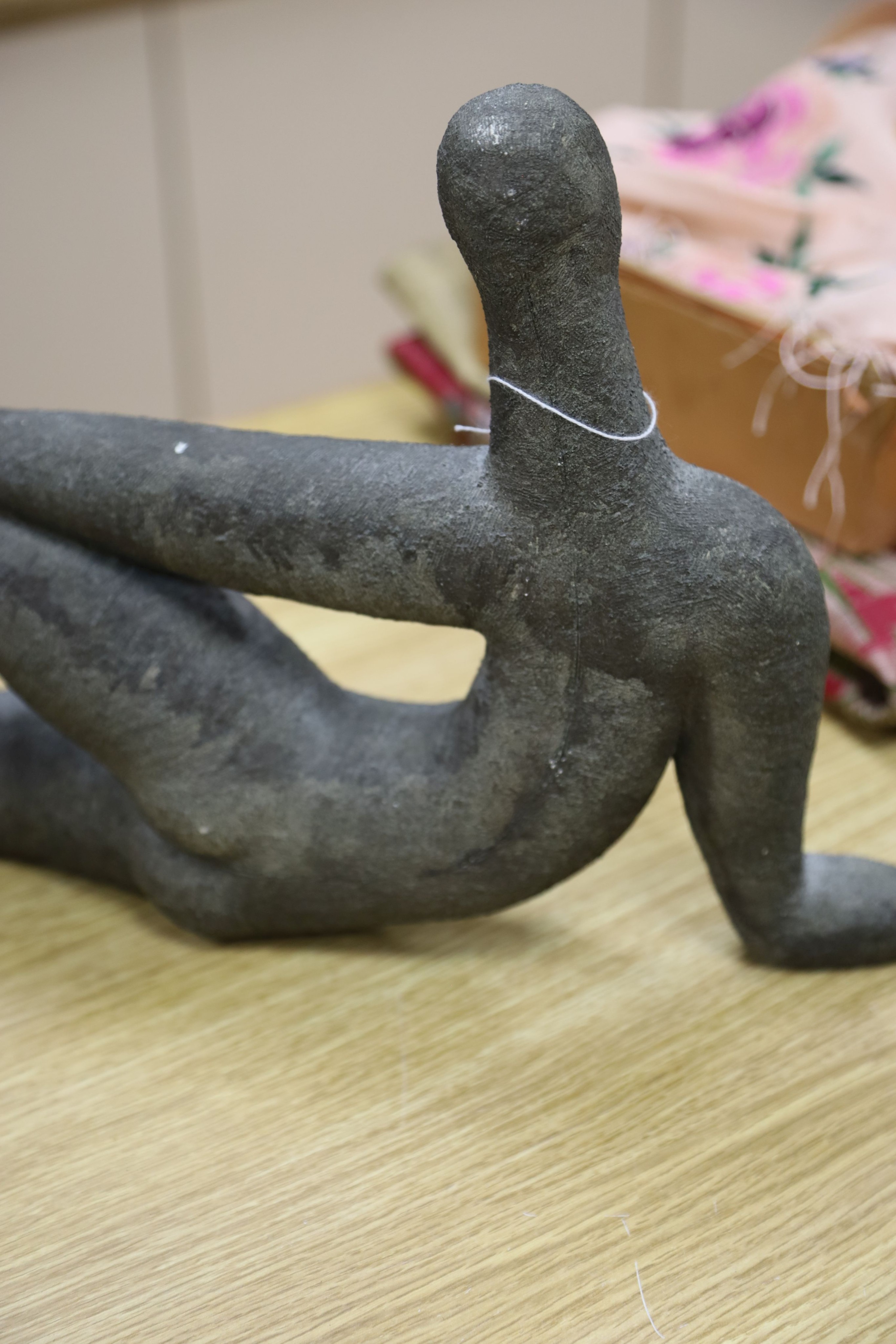 A bronzed pottery abstract figure, marked ‘WP 92’ 40cm